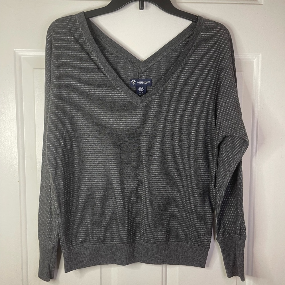 American‎ eagle top in gray and silver strips.